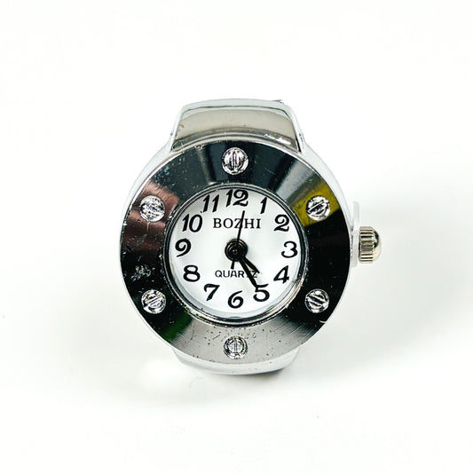 A BOZHI quartz wristwatch with a round silver-tone case, white dial, black numerals, and rhinestone accents on a white background.