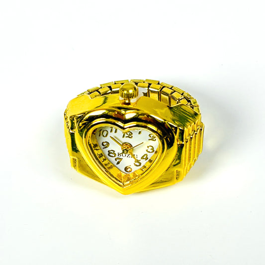 A gold-plated heart-shaped wristwatch with a matching link bracelet, featuring a white dial with black Arabic numerals and gold-tone hands.