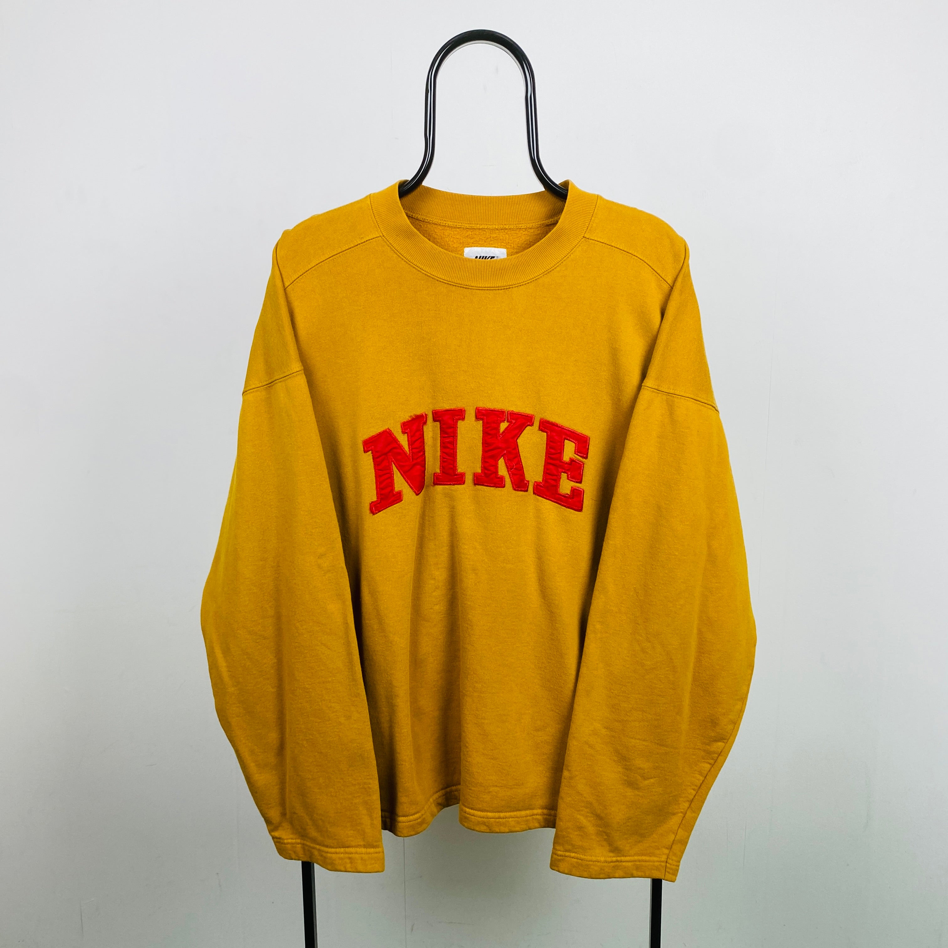 Gold on sale nike sweatshirt