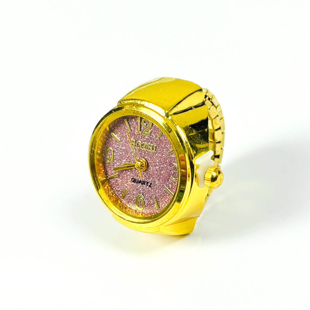 A gold-colored ring-shaped quartz watch with a glittery pink face and gold-tone hands and numerals, set against a plain white background.