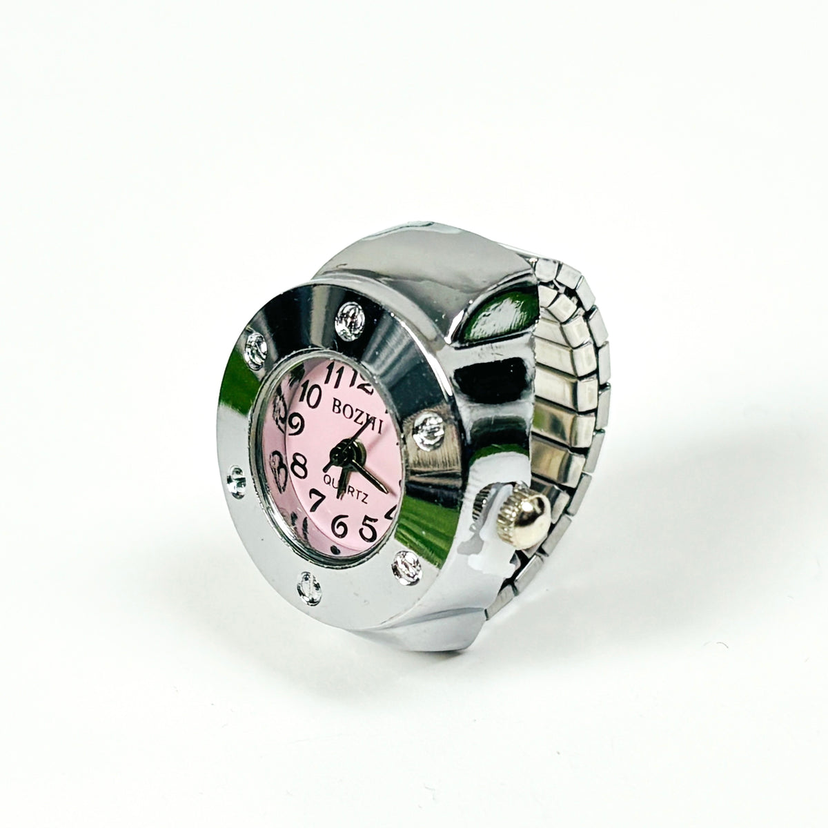 A silver-tone metal watch with a pink dial and rhinestone accents, photographed on a plain white background.