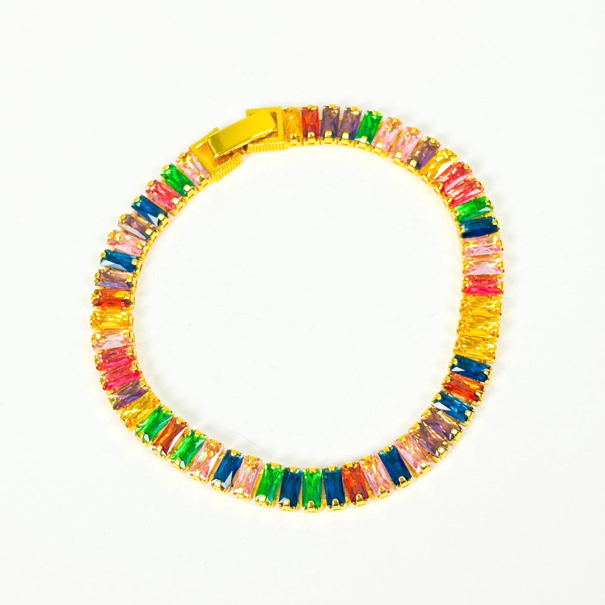 A gold-plated tennis bracelet featuring a row of colorful, rectangular baguette-cut crystals in shades of pink, green, blue, orange, and purple, displayed on a clean white background.