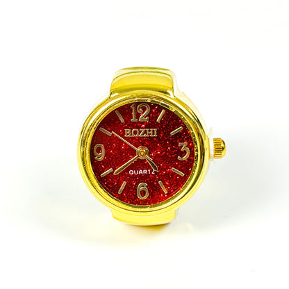 A wrist watch with a gold-tone case and strap, featuring a glittery red round dial with gold-tone numerals and hands. The brand name 'BOZHI' is printed on the dial.