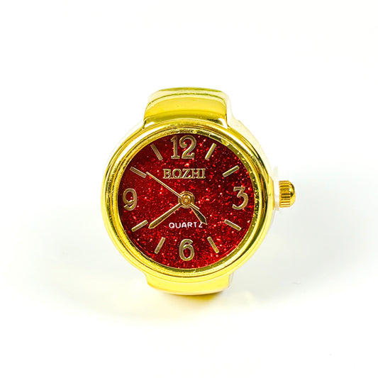 A wrist watch with a gold-tone case and strap, featuring a glittery red round dial with gold-tone numerals and hands. The brand name 'BOZHI' is printed on the dial.